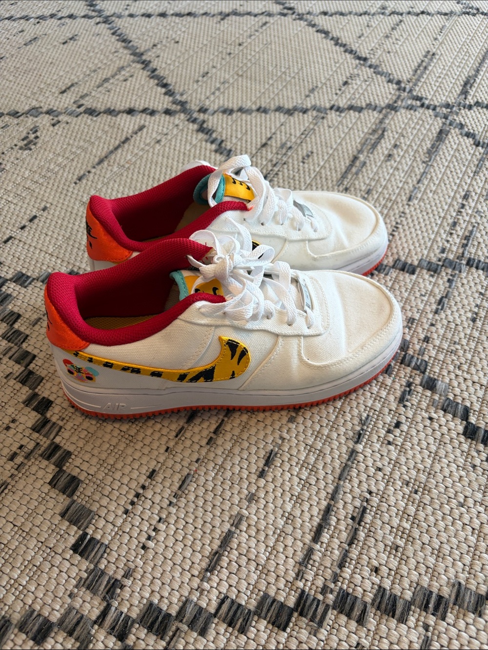 Nike year of the tiger White Low-Top Sneakers with Red and Yellow Accents
